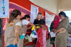 Kristine-Blokhus-Country-Representative-UNFPA-interacting-with-a-beneficary-girl